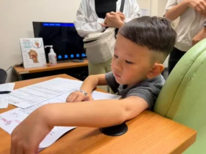 A seven-year-old child with severe hearing loss needs to undergo cochlear implant surgery